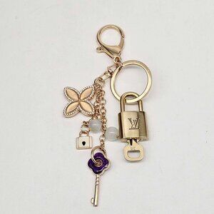Authentic Louis Vuitton Lock & Key with unbranded Clover Flower Bagcharm 101025